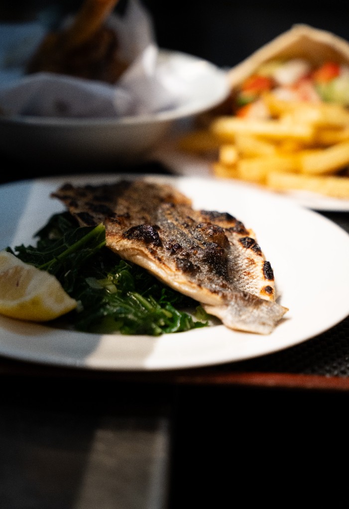 Grilled fish with greens and lemon at Kritamo